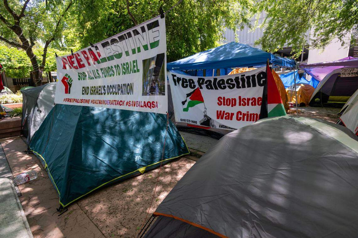 Banners call for a “Free Palestine” at a Students for Justice Palestine encampment at Sacramento State on Wednesday, May 8, 2024. The group had been camped out on the quad since late last month, calling for disclosure of any university ties to Israel and divestment if such ties exist. Sac State recently agreed to alter its investment policy language.
