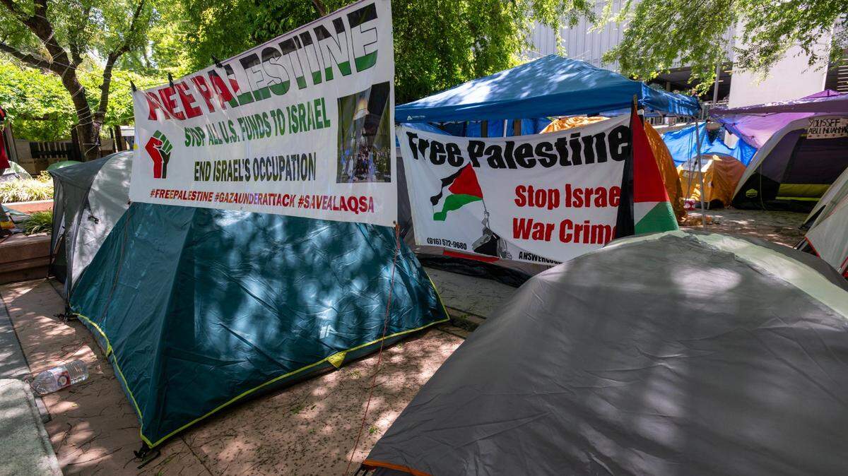 Banners call for a “Free Palestine” at a Students for Justice Palestine encampment at Sacramento State on Wednesday, May 8, 2024. The group has been camped out on the quad since late last month, calling for disclosure of any university ties to Israel and divestment if such ties exist.