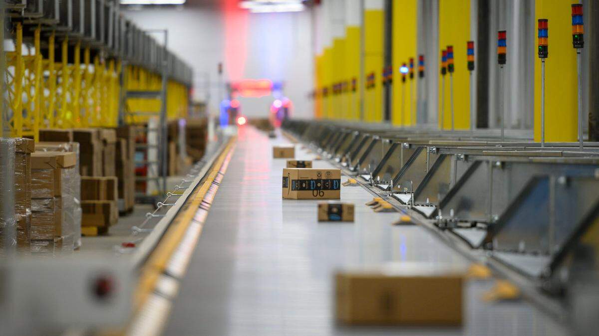 Packages make their way down a conveyor belt at Amazon’s Sacramento warehouse as they are sorted and loaded onto trucks for delivery, Wednesday, Aug 28, 2019. The facility doubled its employment to 4,000 during the pandemic.