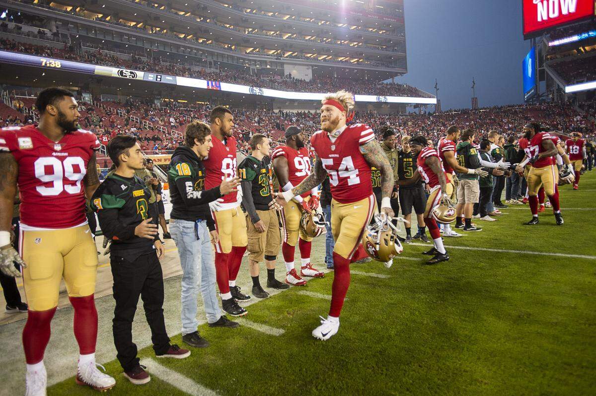 Students from Paradise High School share the filed with the San Francisco 49ers during a game at Levi’s Stadium on Monday, November 12, 2018 in Santa Clara.