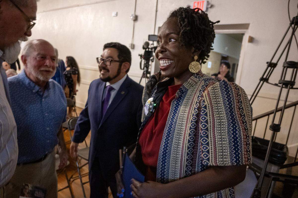 Candidate Flo Cofer meets with attendees before the Sacramento County Supervisors District 1 forum on Thursday at the Coloma Center in Sacramento.