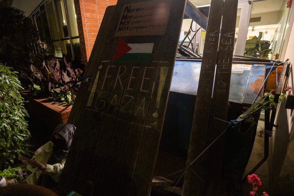 Cal Poly Humboldt student Laura Sanchez sits outside of Siemens Hall, which has been occupied by students and community members calling for a permanent ceasefire in Gaza, on Tuesday, April 23, 2024, in Arcata.