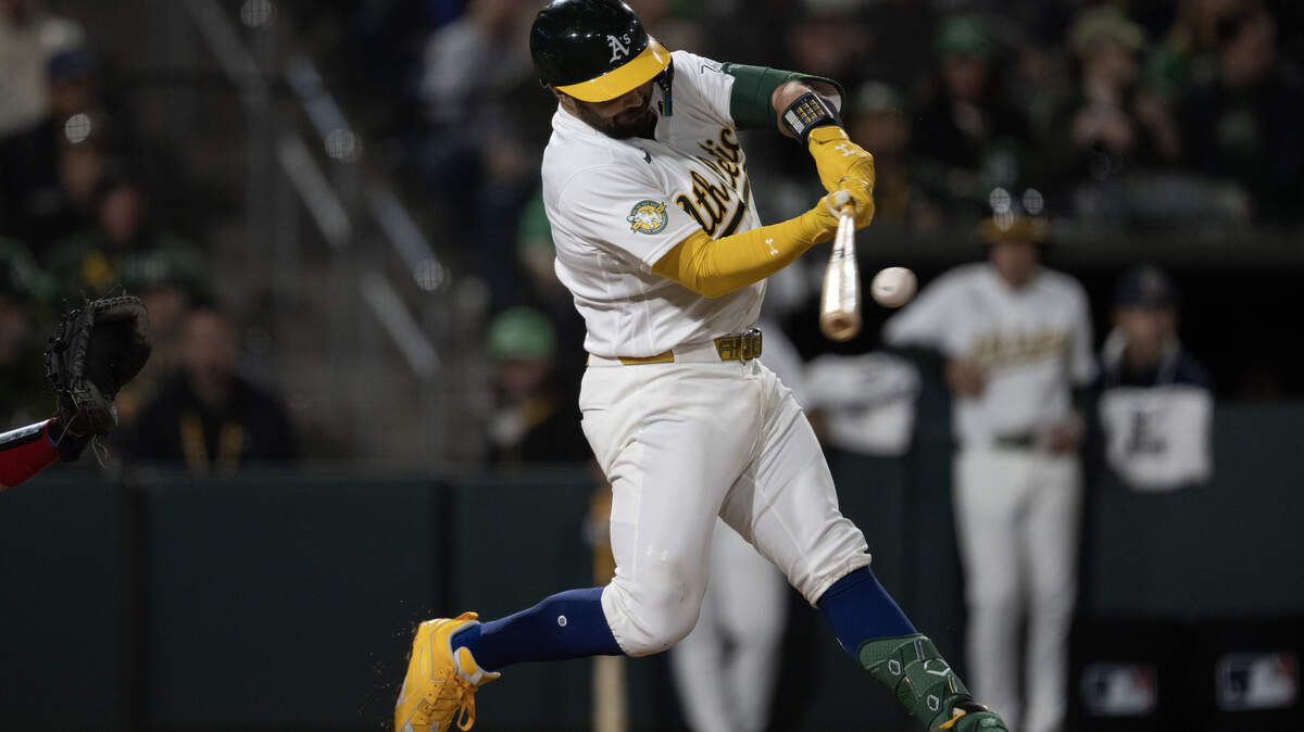 Athletics batter Shea Langeliers hits a three-run home run off Texas Rangers pitcher Cole Winn in the bottom of the sixth inning at Sutter Health Park on April 15 in West Sacramento. Langeliers led all American League catchers in votes received as of the first All-Star voting update released Monday.