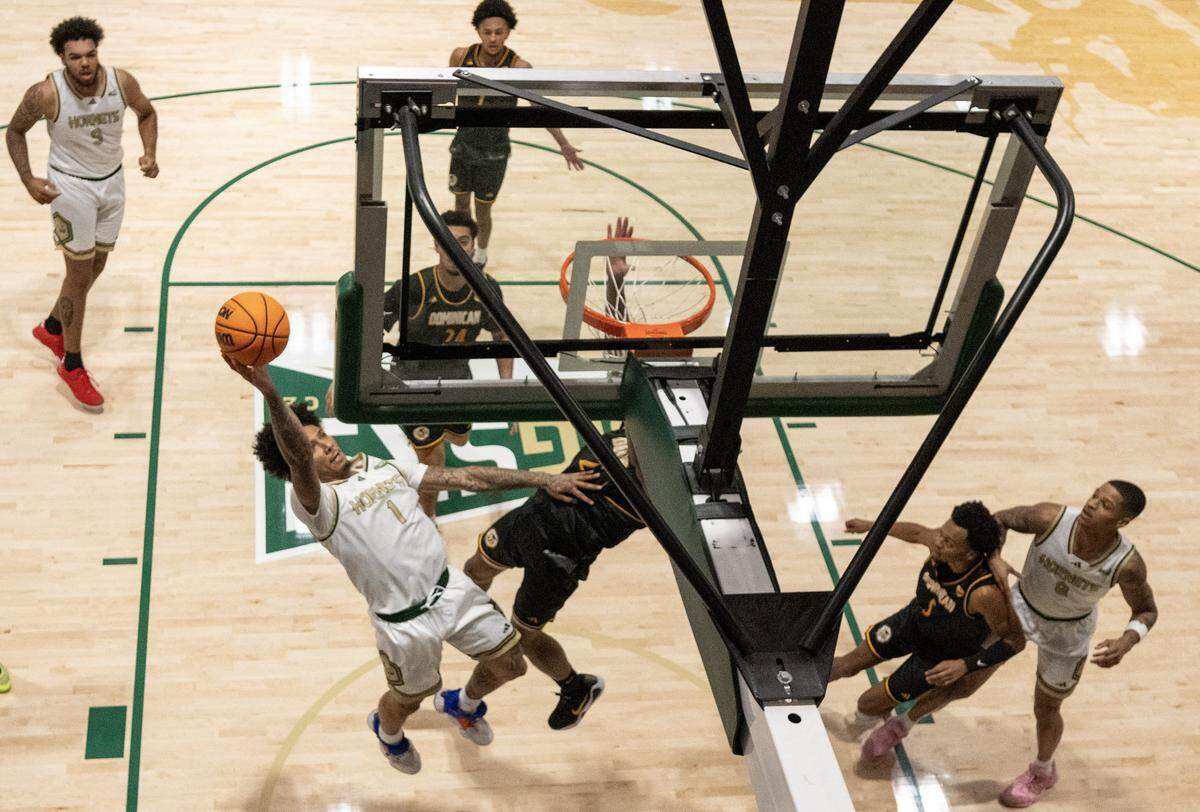 Sacramento State Hornets guard Mikey Williams (1) shoots basket against the Dominican Penguins during a game at the Hornet Pavilion on Tuesday in Sacramento.