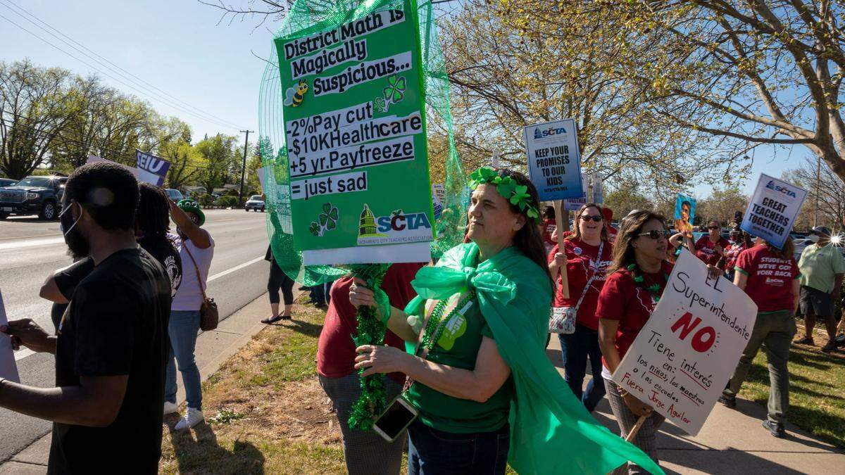 Rosemont teacher Allison Alair protests outside the Serna Center with members of the Sacramento City Teachers Association – the union that represents teachers in the Sacramento City Unified School District – on Thursday, March 17.