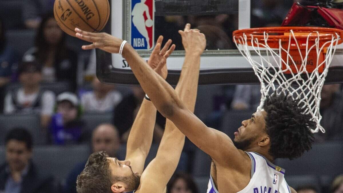 Sacramento Kings forward Marvin Bagley III (35) blocks a shot against the Dallas Mavericks forward Maximilian Kleber (42) on Thursday, March 21, 2019 during their game at the Golden 1 Center in Sacramento, Calif.