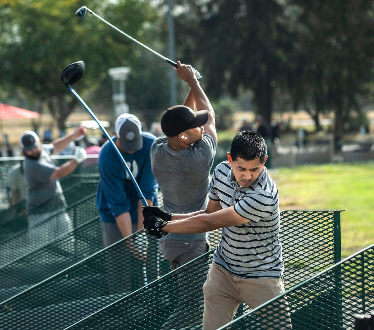 Randy Tagle of Rocklin takes a swing Tuesday at the Haggin Oaks driving range. Tagle said he stopped playing for a while but returned to the game during the pandemic.