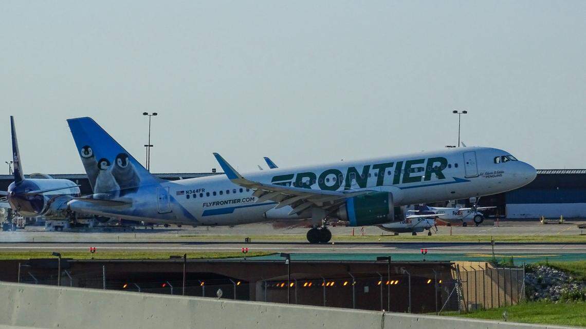 A “belligerent” woman ordered off a Frontier Airlines flight at the Denver airport hit an attendant with an intercom phone, officials say.