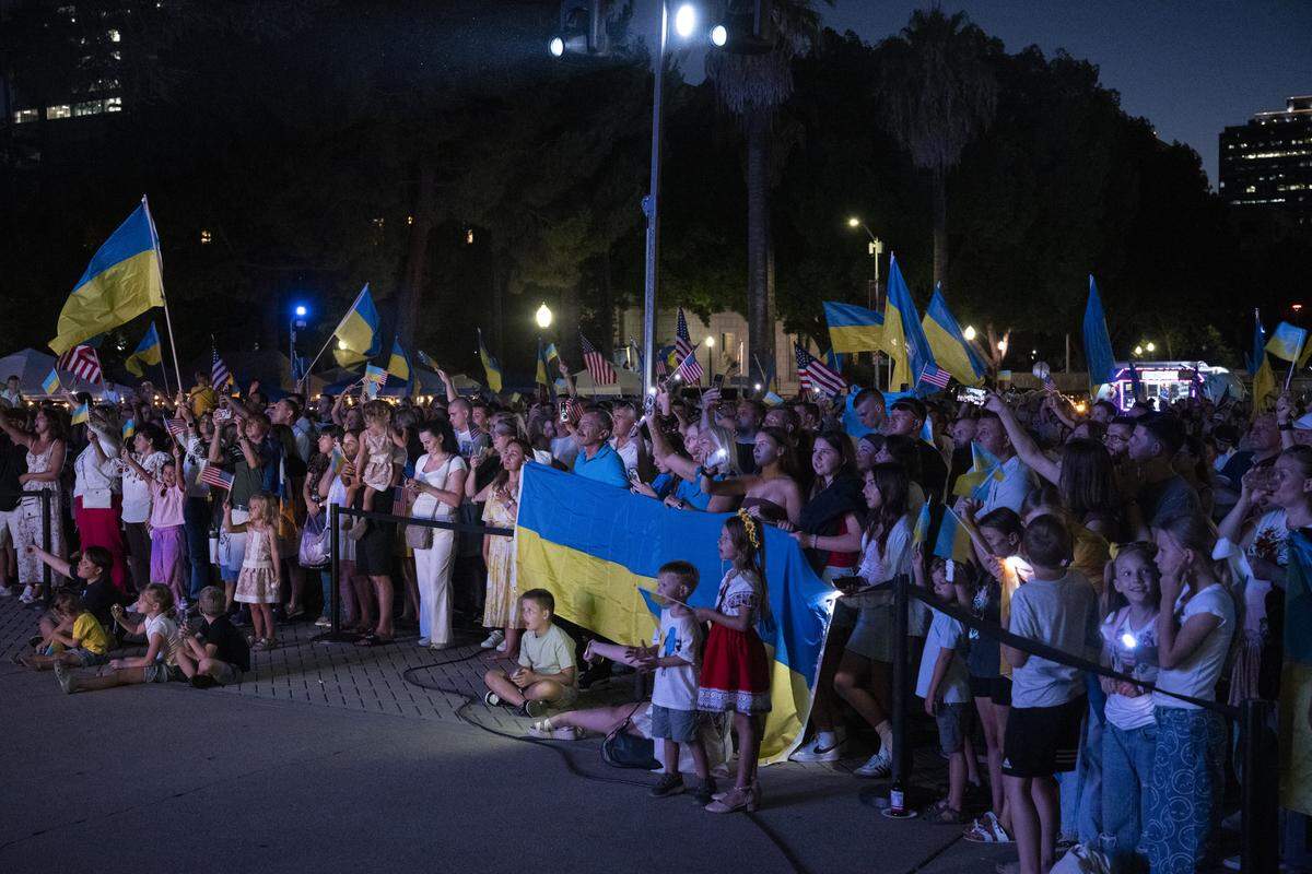 Ukrainian Americans listen to musical performances during a Ukrainian Independence Day celebration at the California Capitol in Sacramento on Sunday.