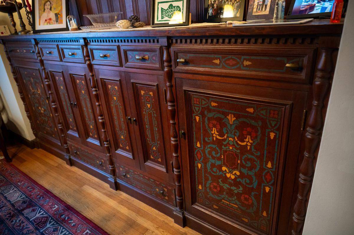 The cabinet doors in the dining room of noted Sacramento architect Leonard F. Starks’ home, which he designed in the 1930s, feature painted panels that match motifs in the ceiling, according to current owner Peter Saucerman.