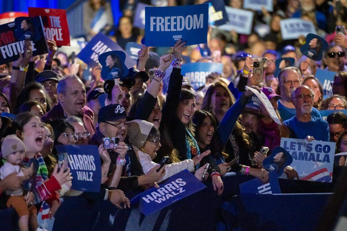 Supporters of Democratic presidential candidate Vice President Kamala Harris cheer for her during a campaign stop at the Reno Events Center on Thursday.