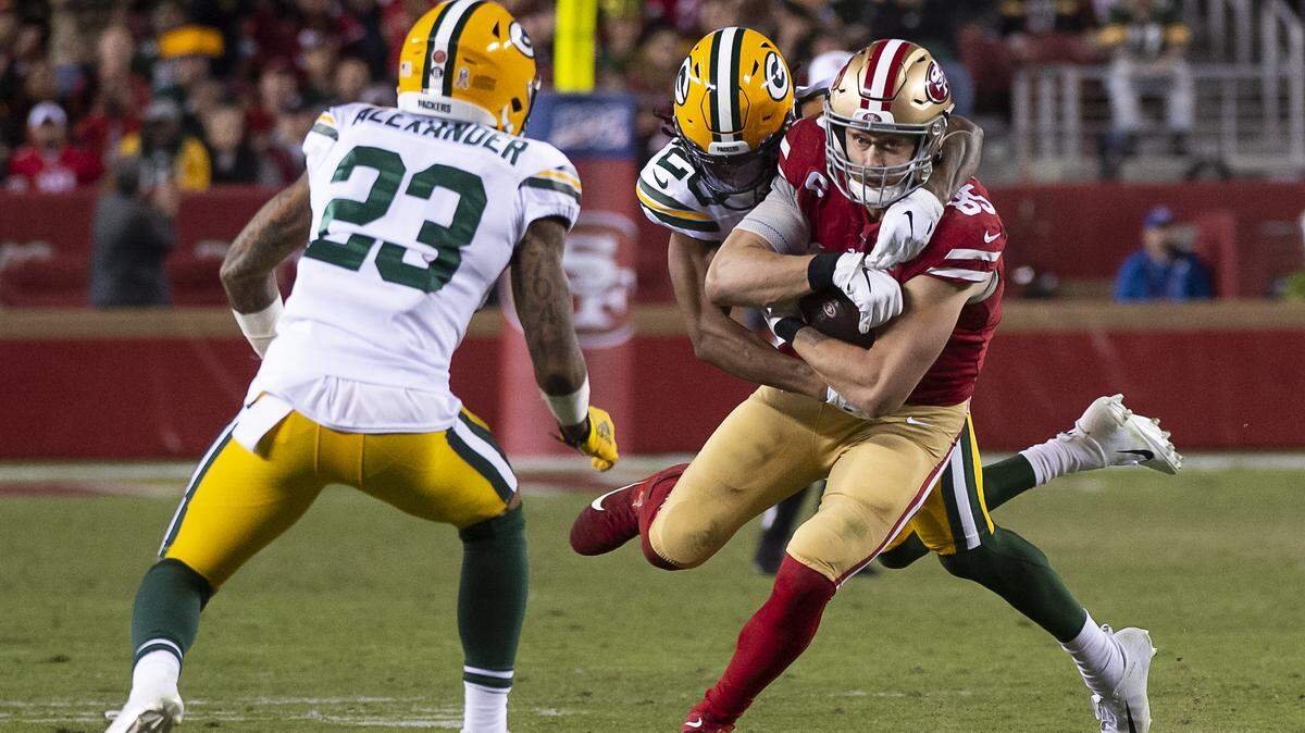 The 49ers' George Kittle is tackled from behind by the Green Bay Packers' Kevin King during a regular-season game Nov. 24 at Levi's Stadium. The teams meet in Santa Clara again Sunday, with the winner heading to Super Bowl LIV.