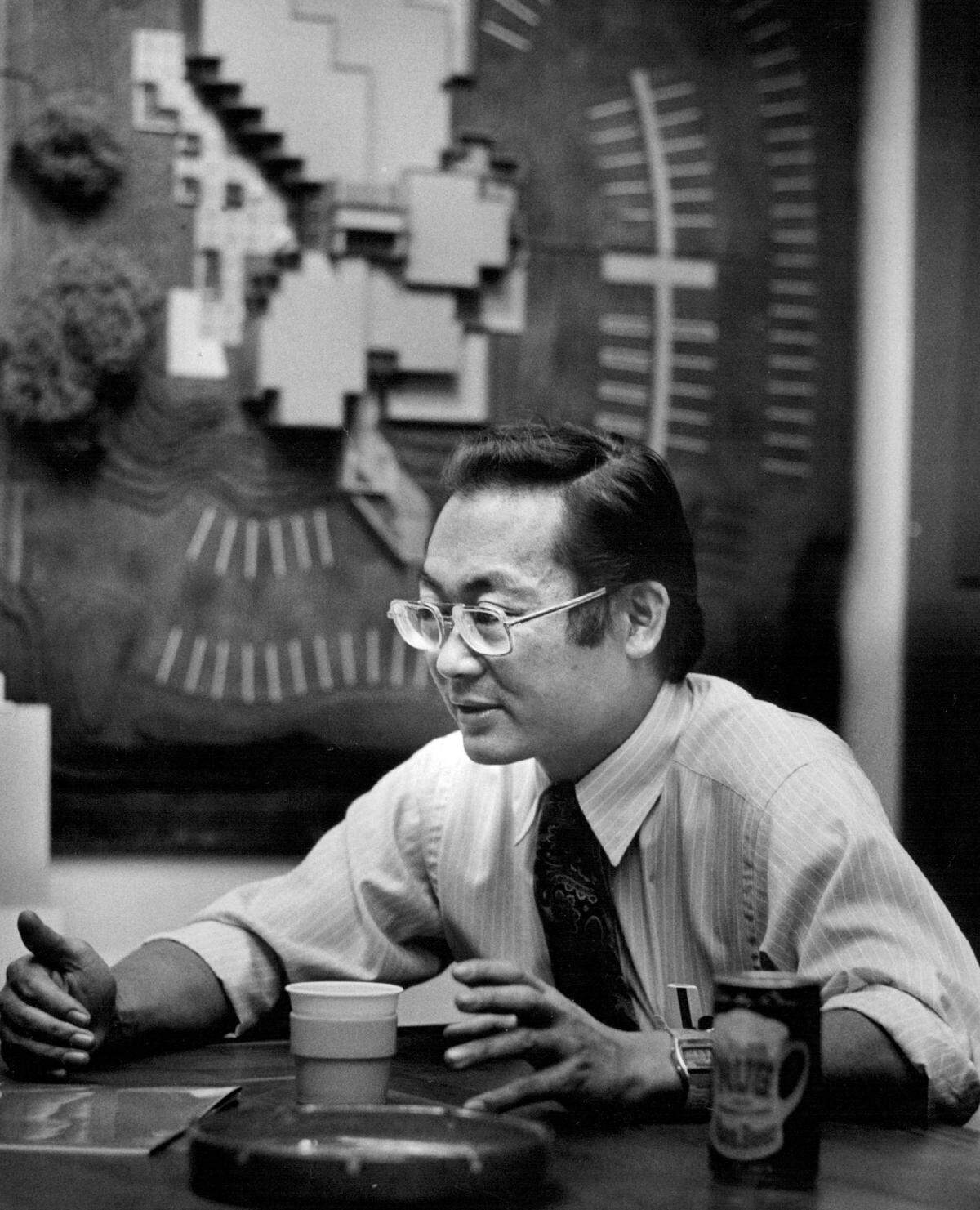 Architect Edwin Kado discusses his projects in his office at E.M. Kado & Associates on 16th Street in Sacramento in 1981. Kado went on to design the ziggurat building in West Sacramento and the Bank of the West Tower at 500 Capitol Mall.