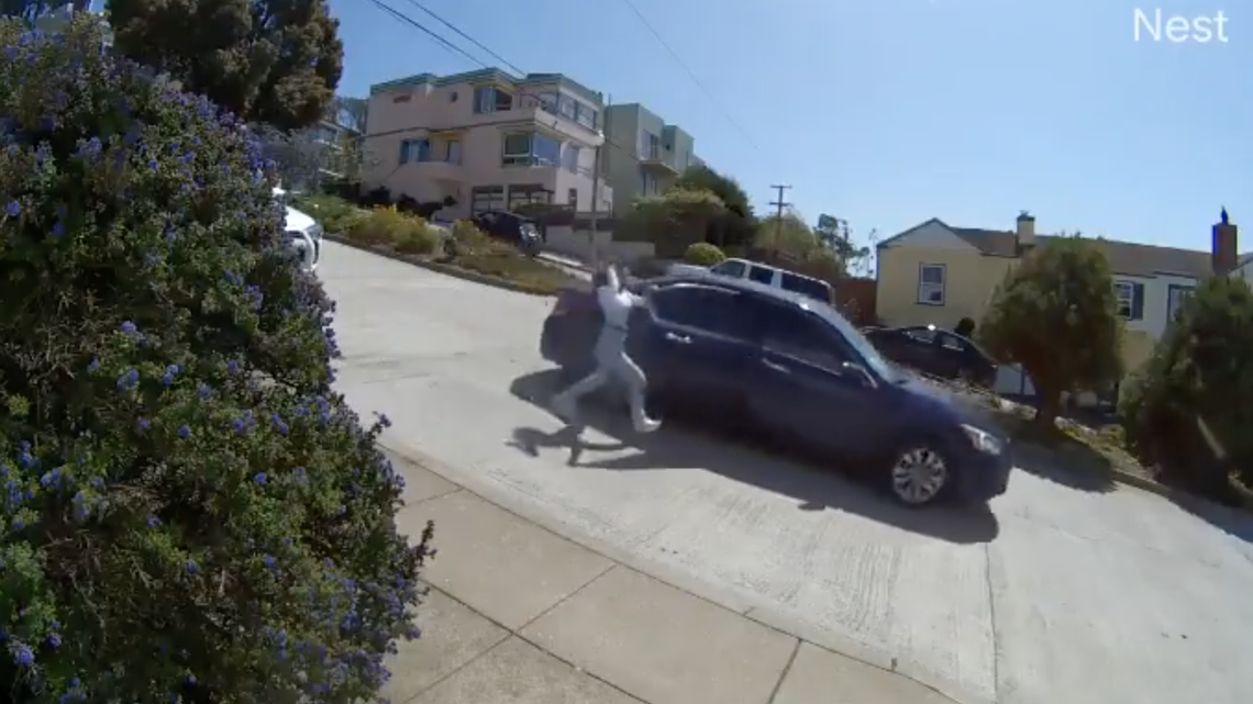 San Francisco Police said two men broke into a family’s car on Moraga Street and stole their backpack. One of the victims grabbed onto the car as it drove away.