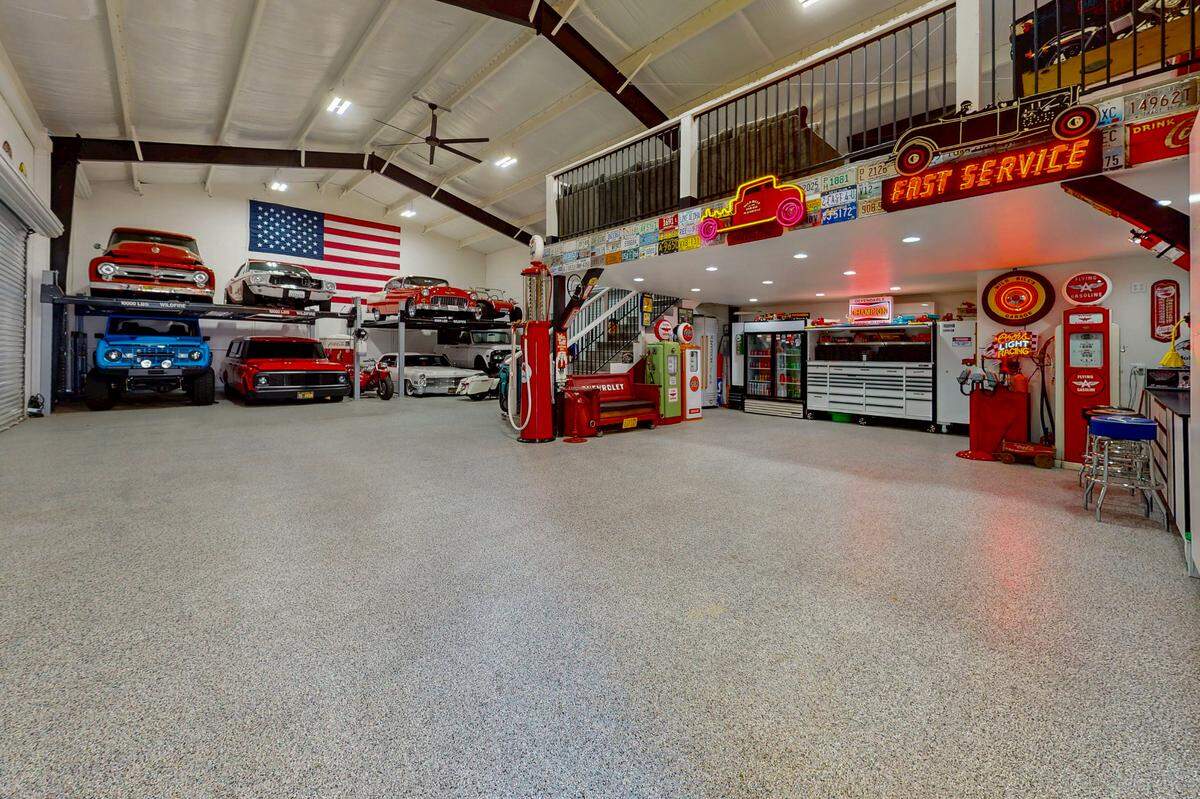 The 2,500-square-foot shop with epoxy flooring is ideal for car collectors. There’s a loft upstairs in which to hang out.