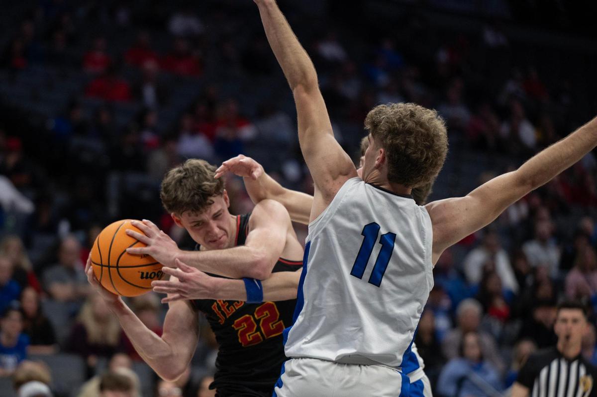The Jesuit Marauders’ Asher Schroeder (22) is double teamed by the Rocklin Thunder’s Reeve Slone (11) and Connor Delaby in the CIF Sac-Joaquin Section Division ll championship at Golden 1 Center on Thursday.
