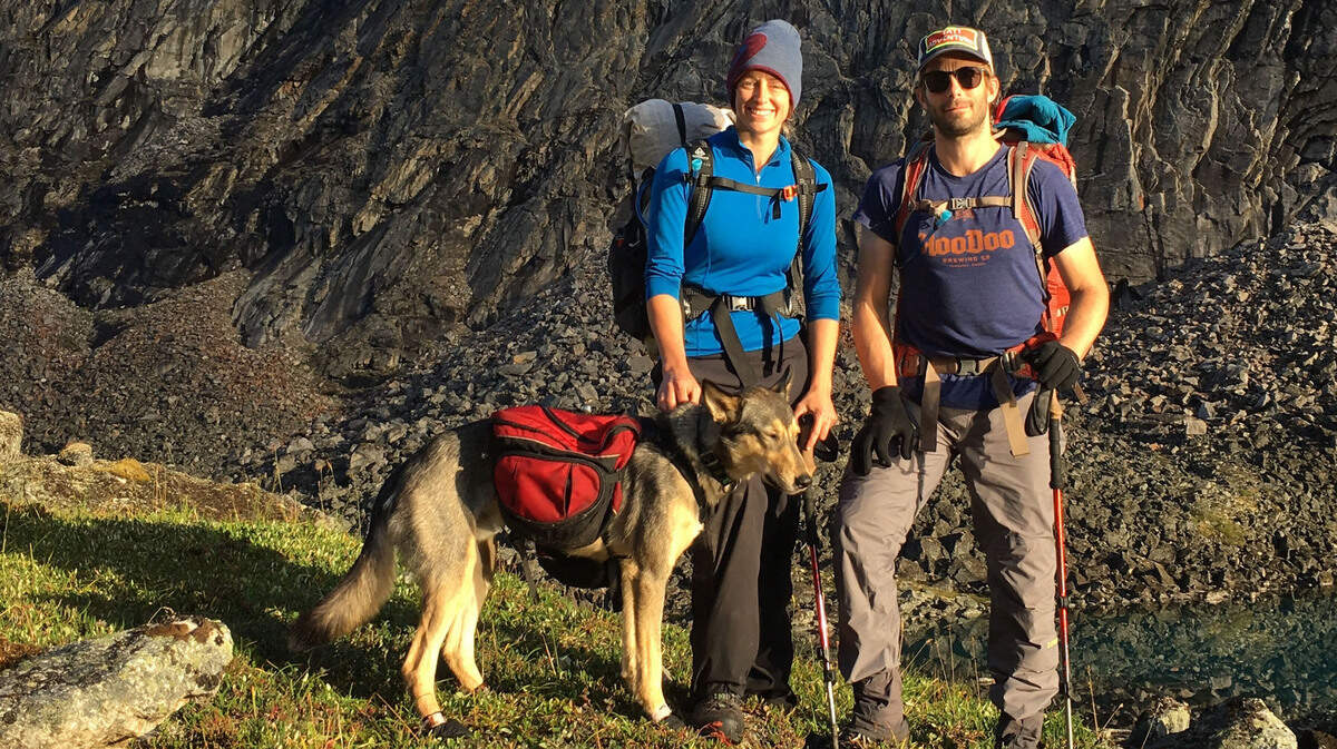 Matt and Jesika Reimer stand with one of their dogs in 2017