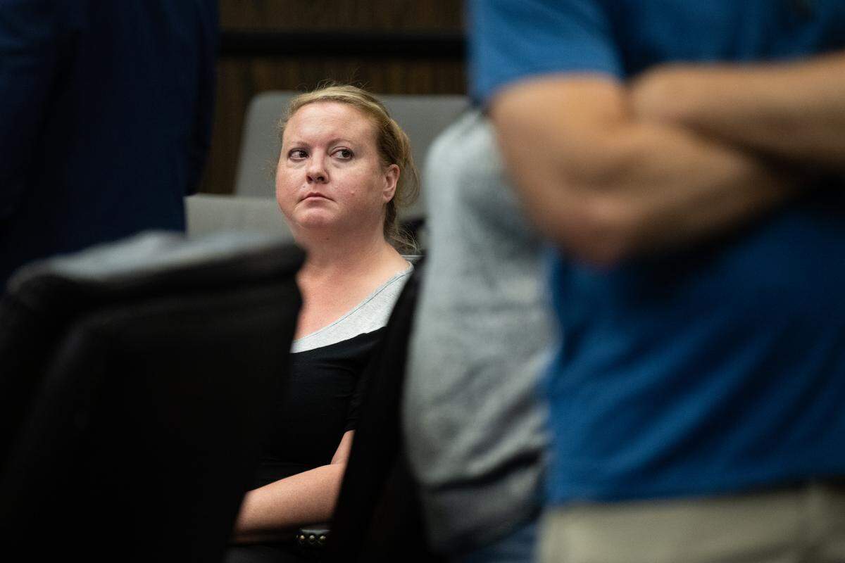 Teacher Kimberly Wohlwend of the now-closed Guiding Hands School waits on Friday to sign paperwork for her guilty plea for involuntary manslaughter in the 2018 restraint death of a student, Max Benson, at the El Dorado Superior Court in Placerville. 