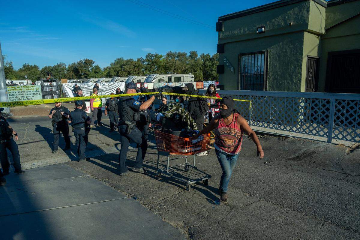 Before being told by police to this leave this area by Sacramento police while they cleared Camp Resolution on Monday, Sacramento Bee photojournalist Renée C. Byer made this image of a homeless resident pulling her things under crime scene tape across from the longtime homeless encampment.