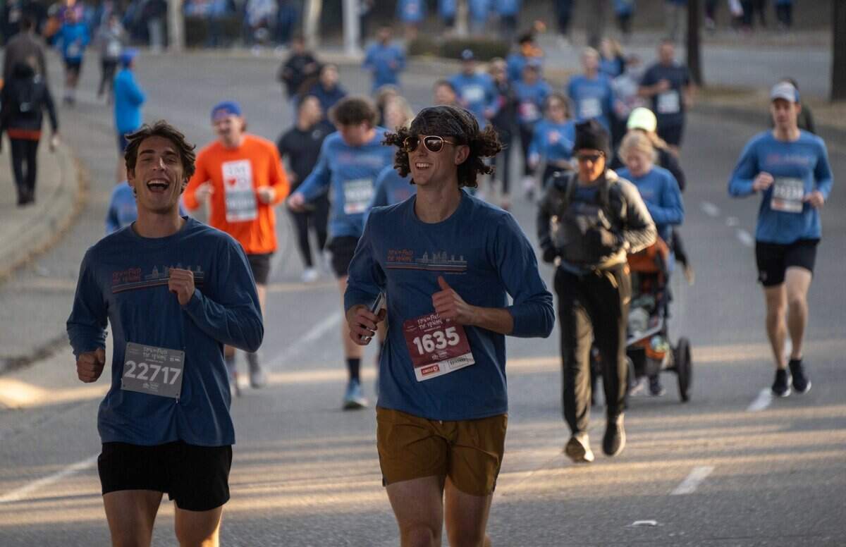 Runners in the 10K race make their way down J Street during the Run to Feed the Hungry in Sacramento, Thursday.