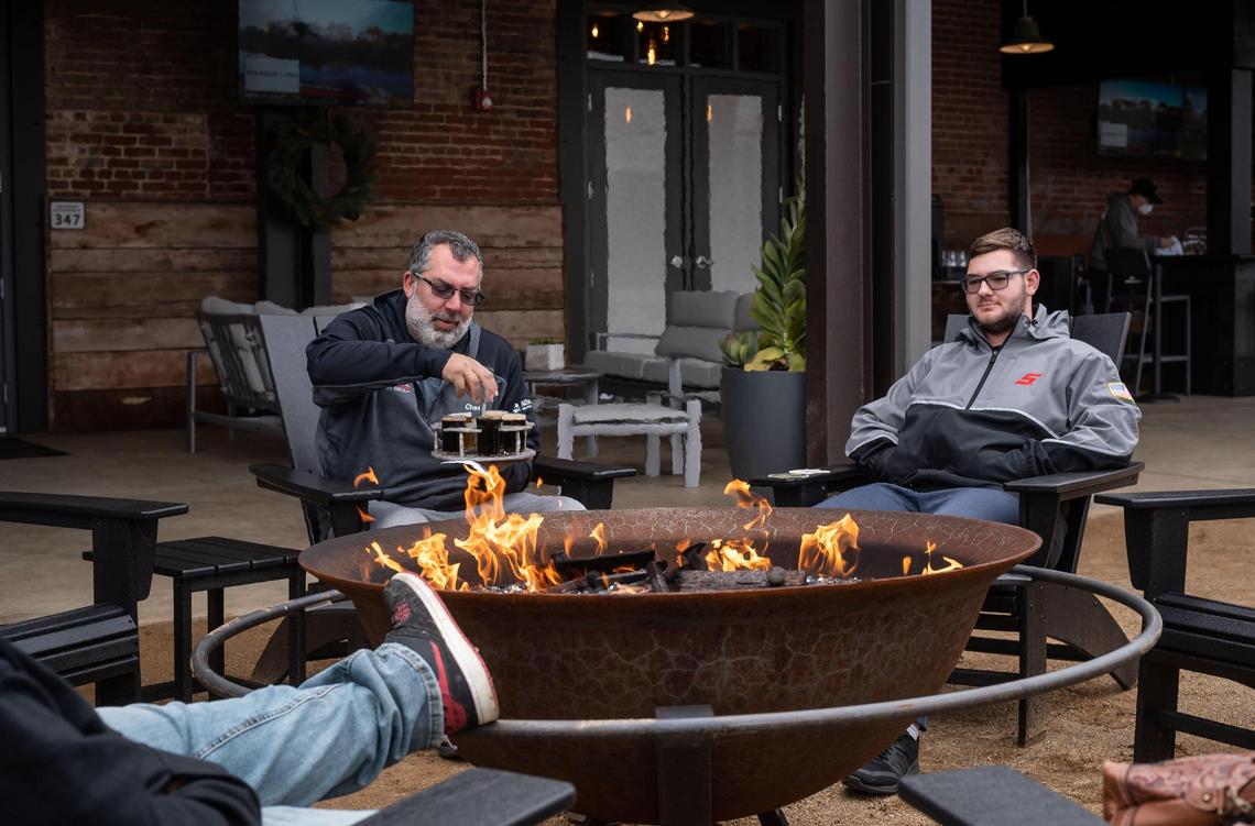 Chad Blesso, left, and his son, Tom Blesso, sit outside on opening day at Dust Bowl Brewing Co.’s Old Town Tap House on Saturday, Dec. 18, 2021, in Elk Grove. The two said they live a short distance away.