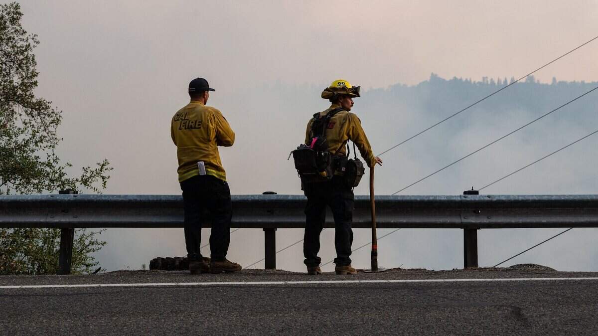 Cal Fire crews work into the evening at the Jones Fire in the South Yuba River canyon bounded by Highway 49 in Nevada County on Tuesday, Aug. 18, 2020.