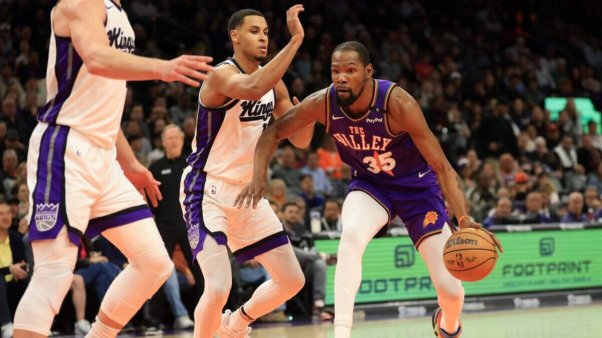 Mar 14, 2025; Phoenix, Arizona, USA; Phoenix Suns forward Kevin Durant (35) dribbles the ball against the Sacramento Kings during the first half at Footprint Center. Mandatory Credit: Mark J. Rebilas-Imagn Images