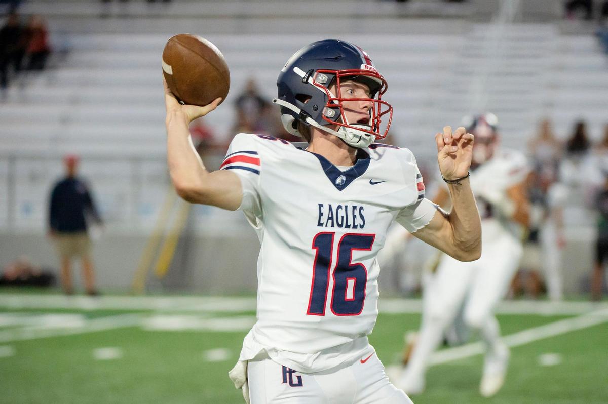 Pleasant Grove Eagles quarterback Cole Davis (16) passes the ball downfield for a first down in the first half during the game on Friday, Sept. 1, 2023, at West Park High School in Roseville.