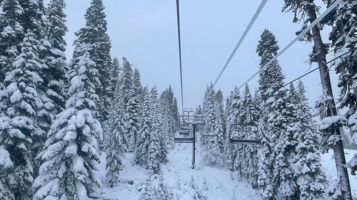 In this photo provided by the Northstar Ski Resort, fresh snow surrounds a ski lift in Truckee on Monday, Dec. 13, 2021.