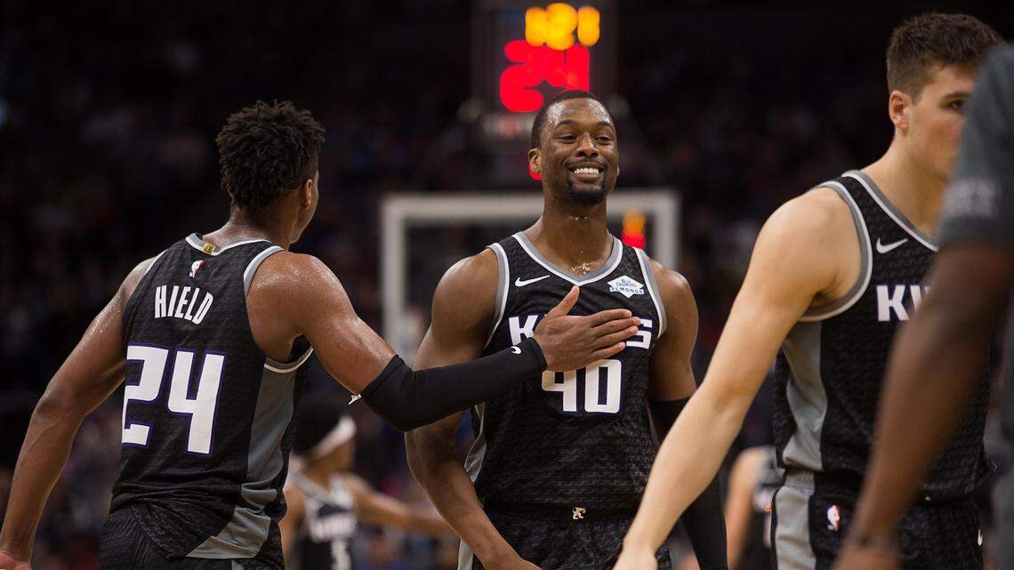 Sacramento Kings forward Harrison Barnes (40) is congratulated by Sacramento Kings guard Buddy Hield (24) after scoring during a game at Golden 1 Center on Monday, March 4, 2019 in Sacramento.