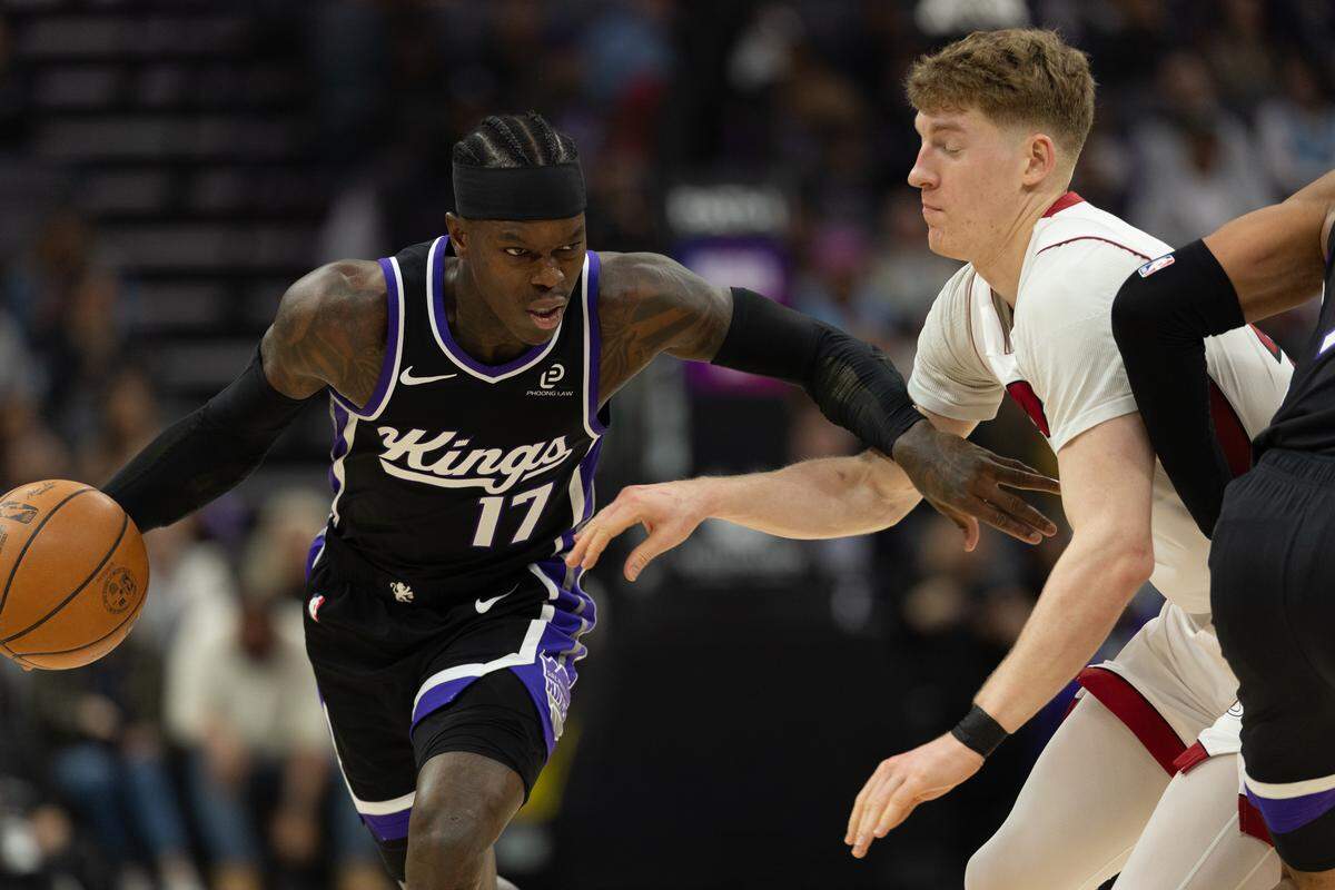 Sacramento Kings guard Dennis Schroder (17) drives down court against Miami Heat guard Kasparas Jakucionis (25) in the first half during a game at Golden 1 Center on Tuesday, Jan. 20, 2026 in Sacramento.