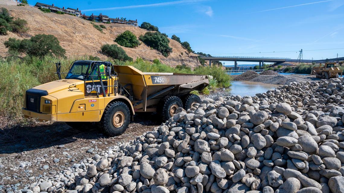 Construction crews restore habitat to protect salmon and steelhead on the American River at Sailor Bar across from the Nimbus Fish Hatchery on Friday Sept. 20, 2019 in Fair Oaks. The Water Forum, U.S. Bureau of Reclamation, U.S. Fish and Wildlife Service, California Department of Fish and Wildlife and Sacramento Area Flood Control Agency are working together to help the fall-run Chinook salmon migrate upstream as adults to spawn from October through December. In the egg-laying process, females create a “nest” in loose gravel in flowing water, deposit their eggs and then cover them up with gravel. The project will carefully place gravel in the river before fall-run salmon are triggered by cooling temperatures to migrate up stream and spawn.