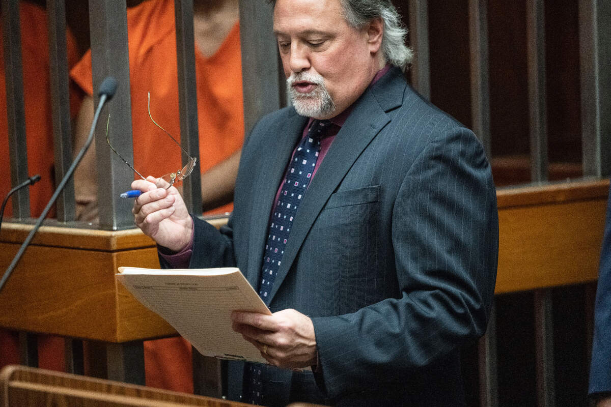 Deputy Public Defender Norm Dawson reviews the rules for the media issued by Sacramento Superior Court Judge Scott Tedmon prohibiting journalists from showing the face of suspect DeSean Leon Brasser Jr. during his arraignment on Monday for a fatal shooting near an East Sacramento tennis club last week.