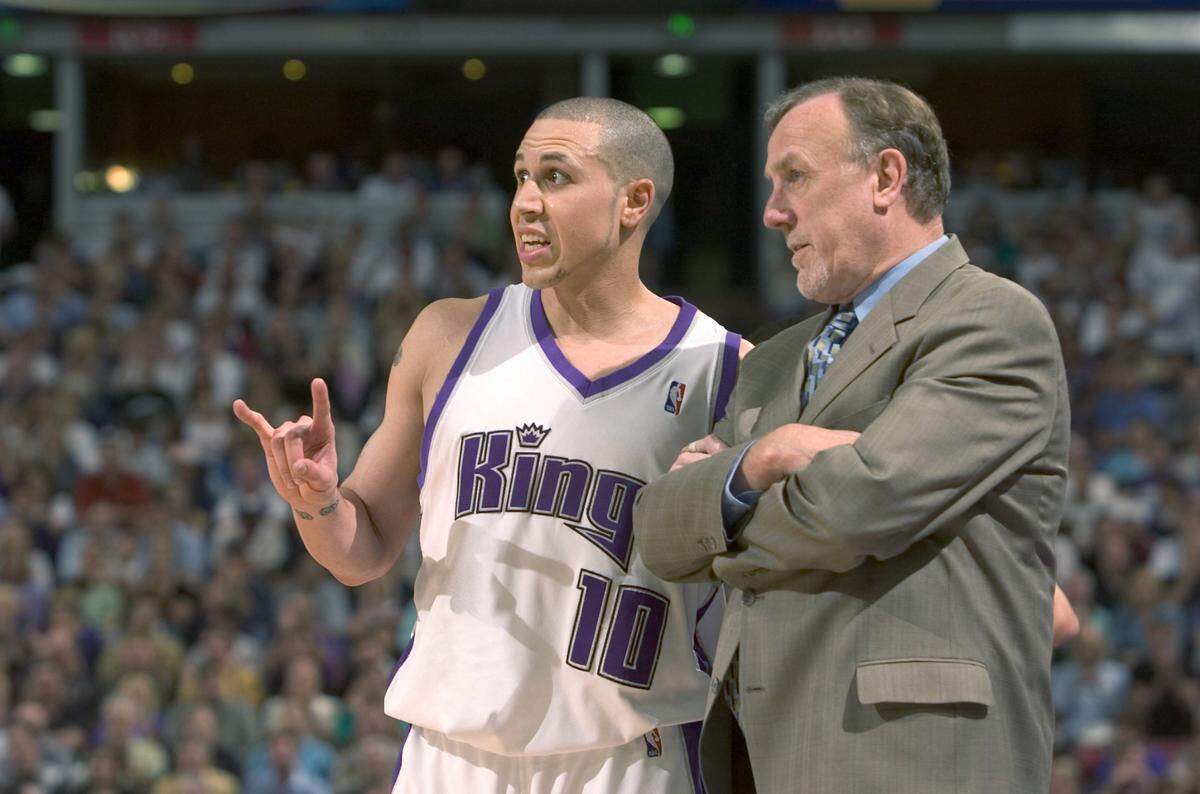 Sacramento Kings guard Mike Bibby and coach Rick Adelman discuss strategy against the San Antonio Spurs at Arco Arena on May 5, 2006, in Game 6 of the first round of the Western Conference playoffs, the team’s last appearance in a playoff game.