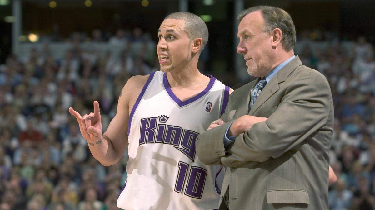 Sacramento Kings guard Mike Bibby and coach Rick Adelman discuss strategy against the San Antonio Spurs at Arco Arena on May 5, 2006, in Game 6 of the first round of the Western Conference playoffs, the team’s last appearance in a playoff game.