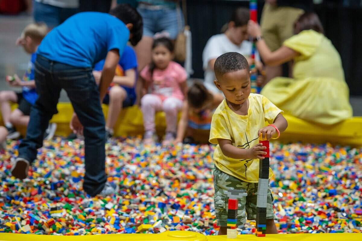Jahai Jamison-Richardson, 3, builds a tower in the Lego pit at the Brick Fest Live on Sunday, Oct. 2, 2022, at SAFE Credit Union Convention Center in downtown Sacramento.