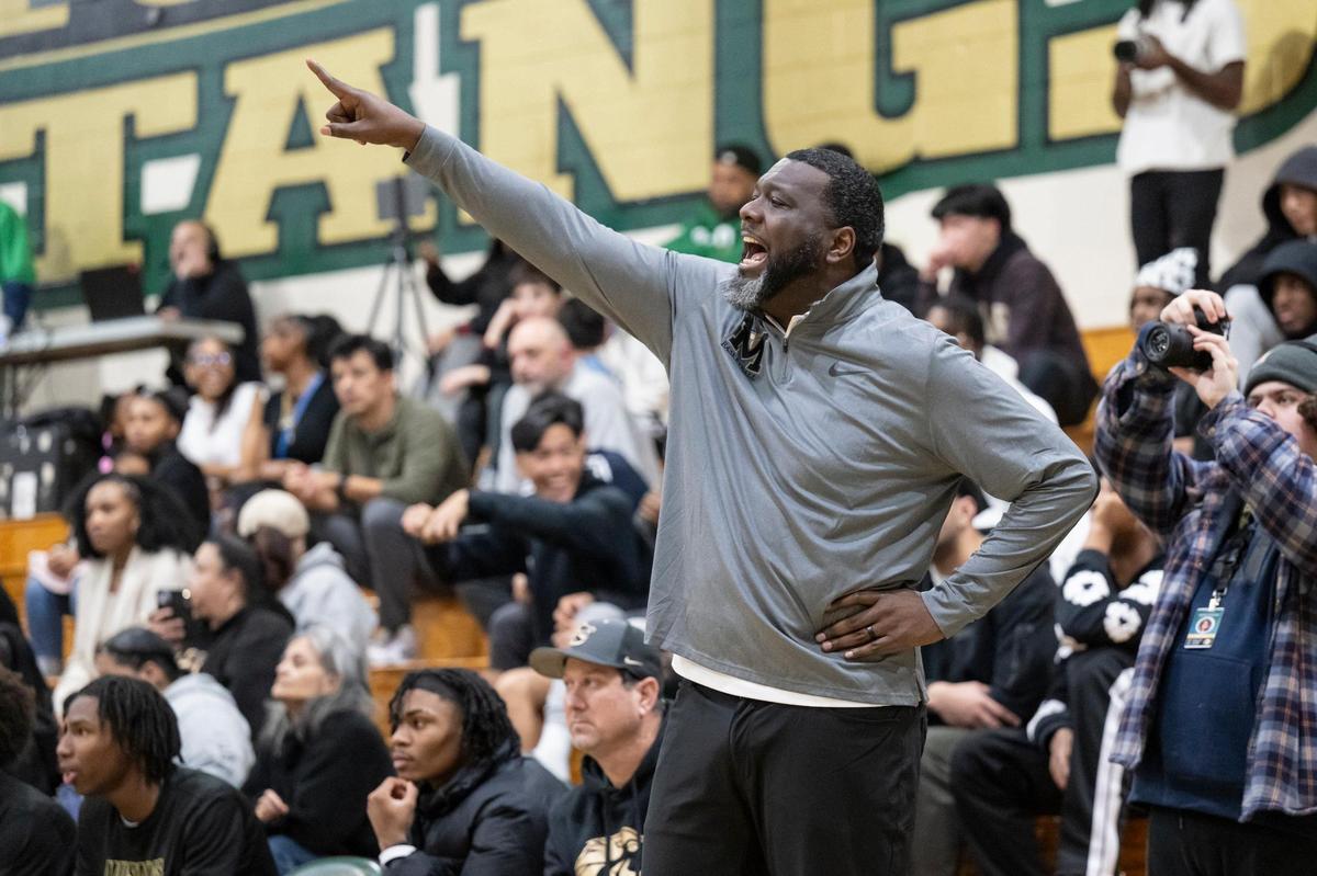 Monterey Trail Mustangs coach Robert Fields calls out to his team during the first half of the game on Jan. 10 at Monterey Trail High School in Elk Grove.