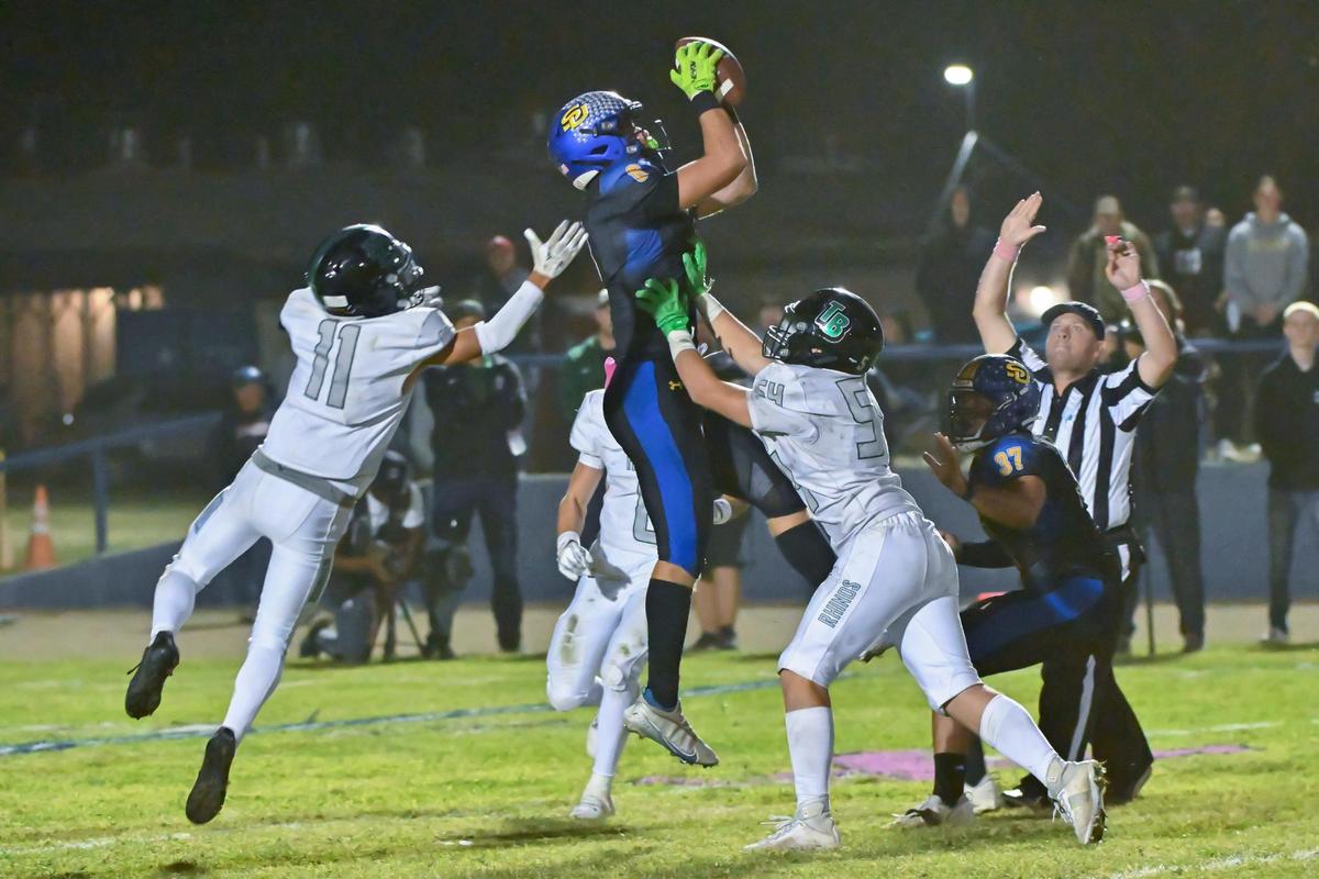 Sutter’s Mason Cartwright makes an interception against Twelve Bridges on Thursday. Cartwright had 16 tackles in the Huskies’ loss.