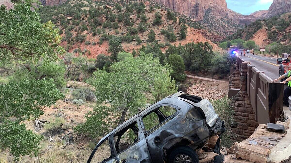 Officials say a man crashed his silver minivan on the Canyon Junction Bridge in Zion National Park after a chase on Aug. 31, 2021. He was taken into the hospital for minor injuries, and his identity hasn’t been confirmed.