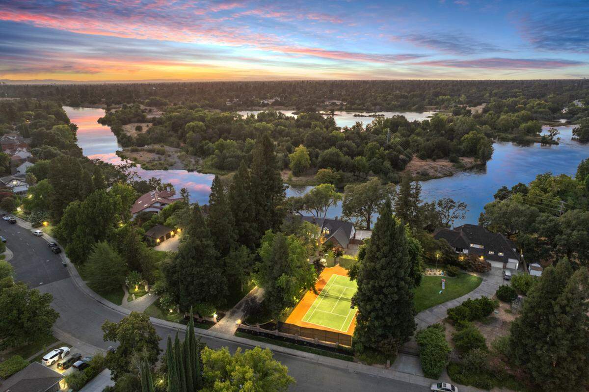 A dramatic entry: From the gated drive lined with manicured trees to the lighted pickleball and tennis court, the estate’s arrival is as impressive as its views.