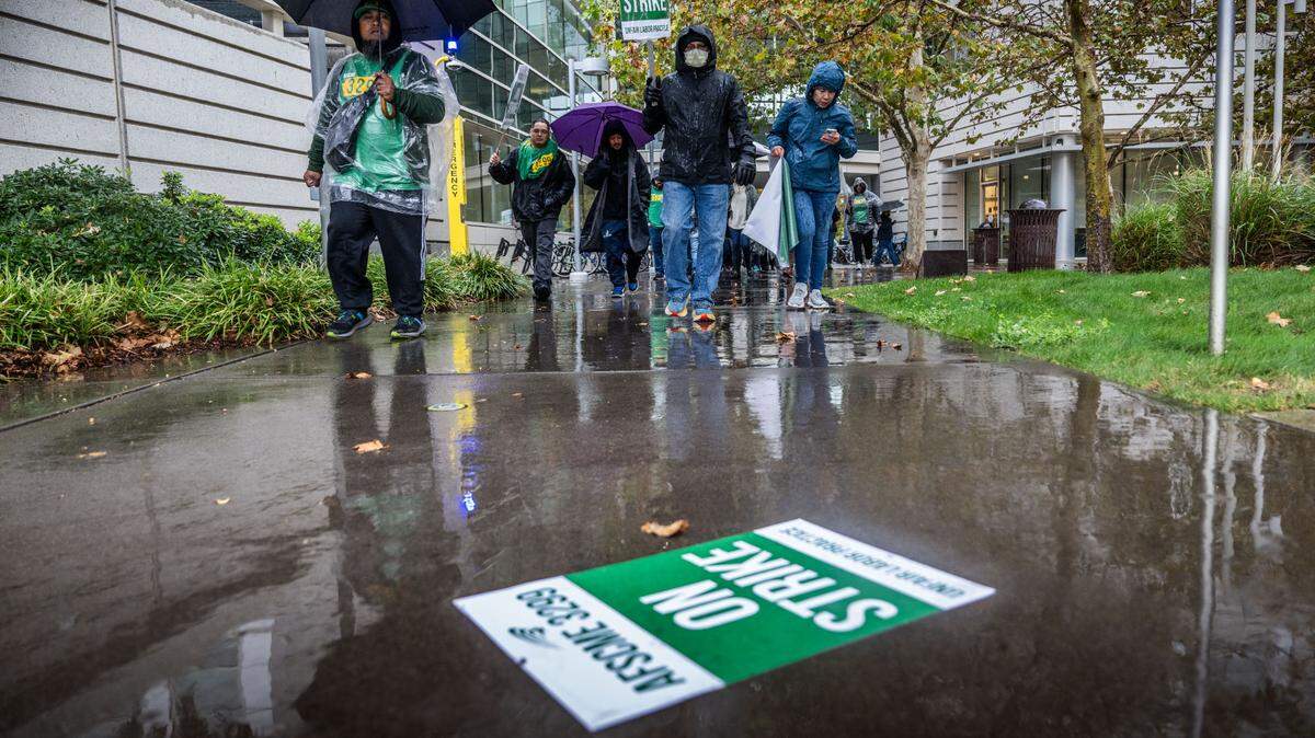 Three AFSCME staff members were arrested Feb. 5, 2026, while protesting at UC Riverside.  In this photo from November 2024, UC Davis Medical Center workers and supporters march on the Sacramento campus during a statewide strike by AFSCME Local 3299. 