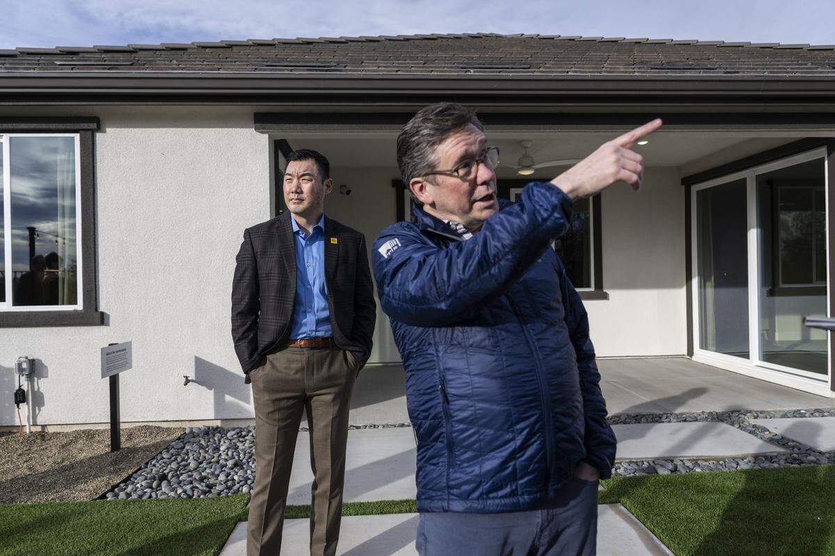 Roy Wright, CEO of the Insurance Institute for Business & Home Safety, points out wildfire protection features Wednesday in the backyard of a home in Northern California’s first Wildfire Prepared Neighborhood in Cameron Park. 