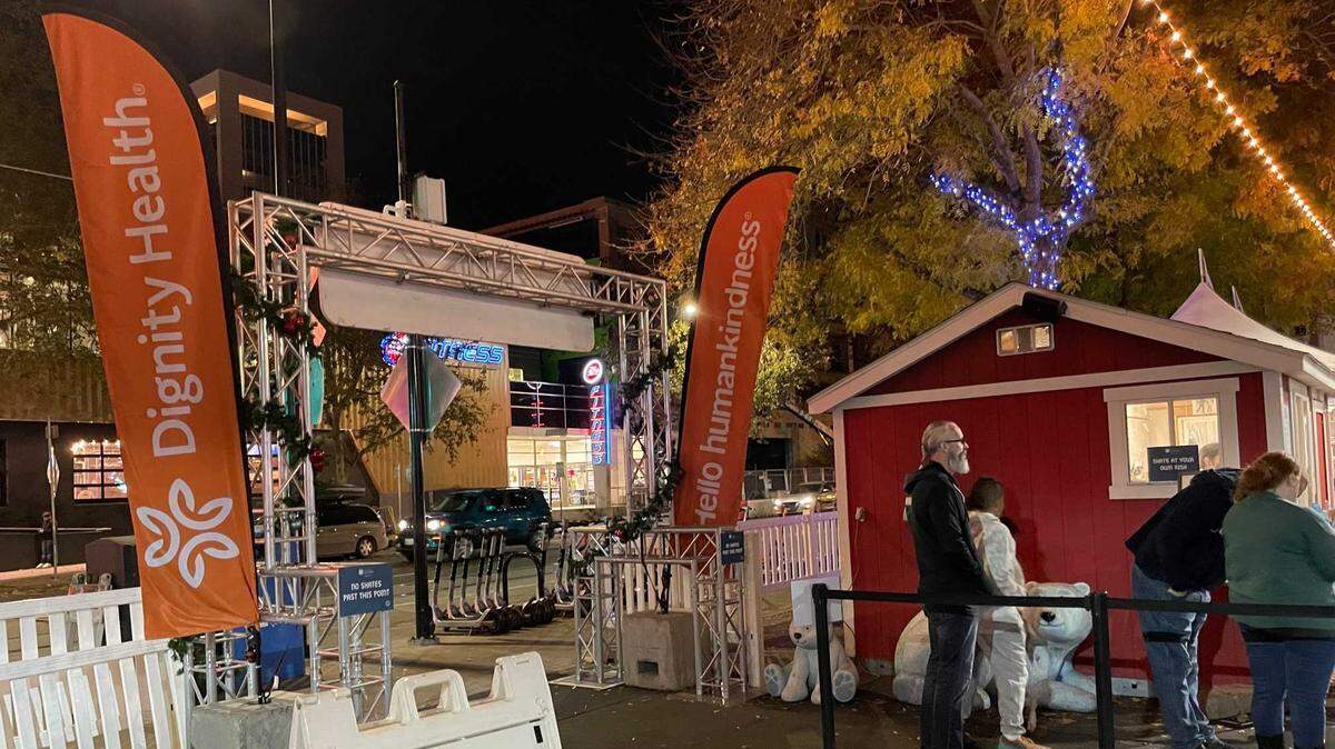 Banners for Downtown Sacramento Partnership funder Dignity Health are seen at the entrance of the downtown ice rink on Tuesday, Nov. 23, 2021. The city’s LGBTQ+ community says the health care giant “is taking a leading role in the fight to limit health care” to lesbian, gay, bisexual, transgender and queer people and its sponsorship at the downtown attraction hampers diversity and inclusion.