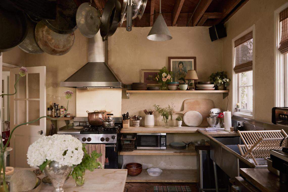 The style of the home captures the essence of 1920s Los Angeles, from its original hand-troweled plaster walls and vintage tilework to naturally lit rooms that open seamlessly to lush courtyards.