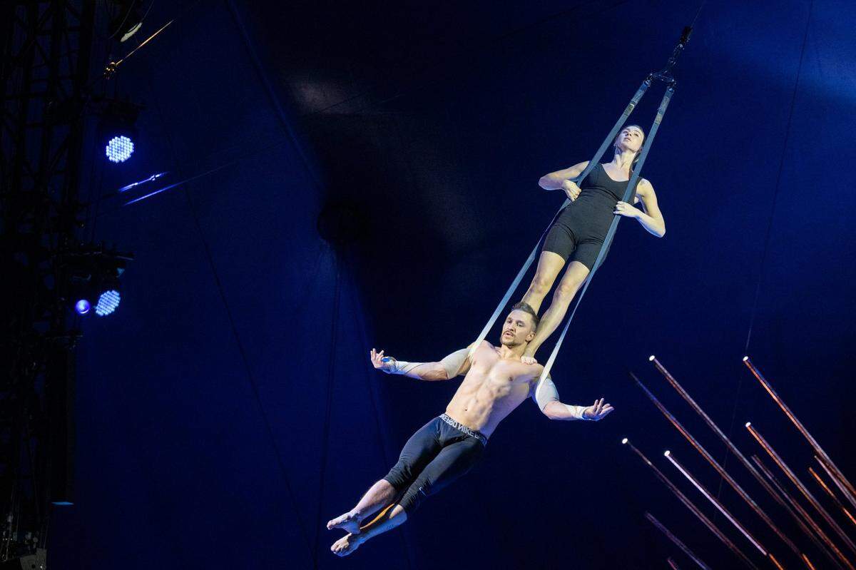 Straps artists Alexey Turchenko and Yulia Makeeva rehearse during the Cirque du Soleil production of Alegría at Sutter Health Park in West Sacramento on Wednesday, July 27, 2022.