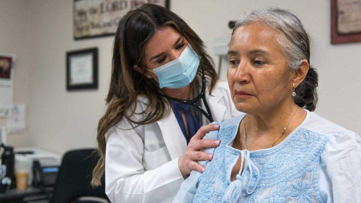 Alina Arzola is examined by Ericka Carranza-Perez, a physician assistant at St. Lukeâs Family Practice assigned to uninsured patients. Arzola, an immigrant from Guanajuato, Mexico, has diabetes and visits the clinic for checkups. Carranza-Perez became Arzolaâs confidante while she was getting a divorce.