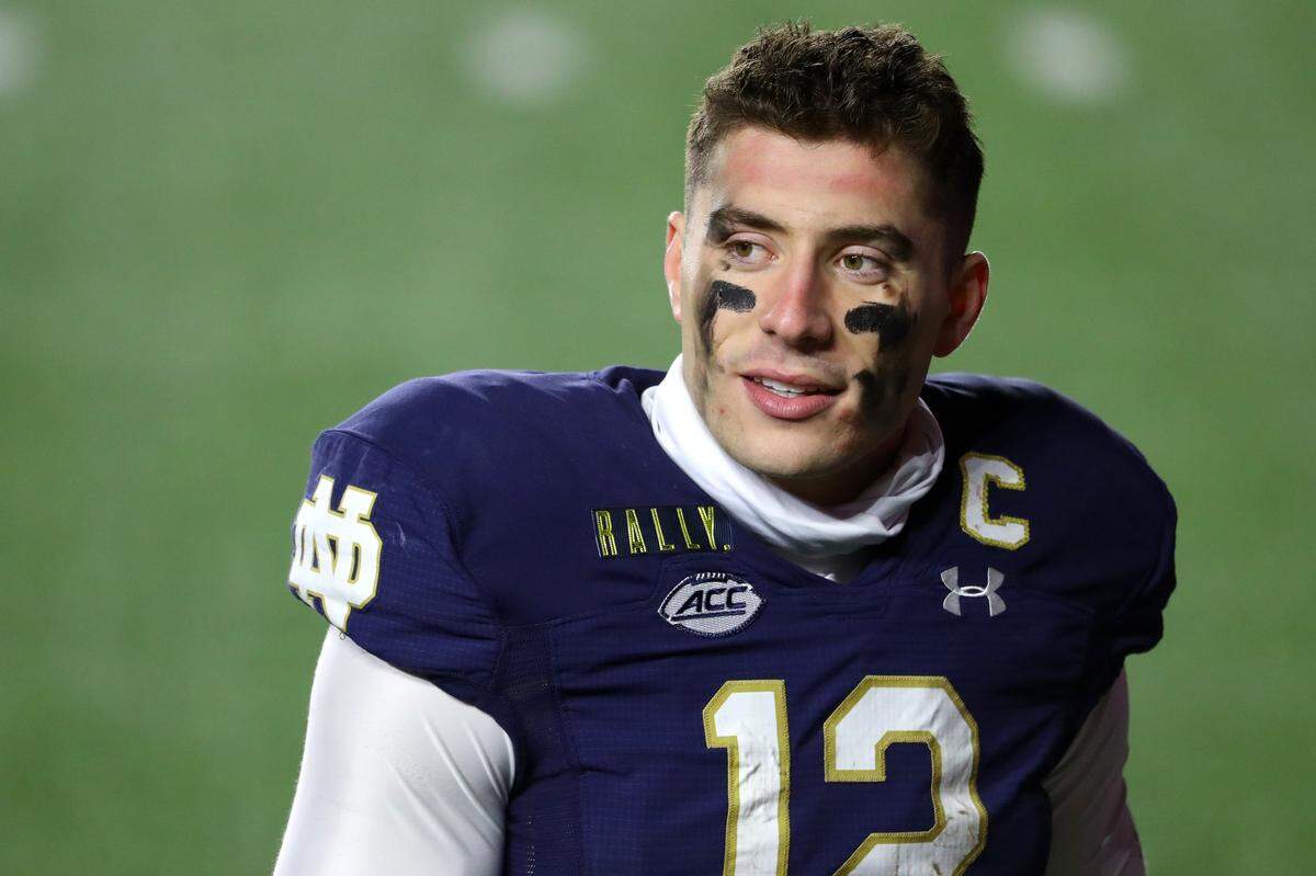 CHESTNUT HILL, MASSACHUSETTS - NOVEMBER 14: Ian Book #12 of the Notre Dame Fighting Irish looks on after the Fighting Irish defeat the Boston College Eagles 45-31 at Alumni Stadium on November 14, 2020 in Chestnut Hill, Massachusetts. (Photo by Maddie Meyer/Getty Images)