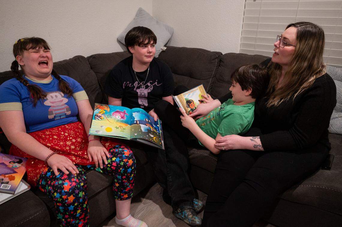 Meagen Reveles Kuntz reads with her three children, all who have special education requirements, at their home in Woodland on Tuesday. Several months into fifth-grade, Reveles Kuntz realized her daughter’s academic progress had regressed. She has since been battling Woodland Joint Unified School District to provide the special ed services outlined in her daughter’s individualized educational plan (IEP).