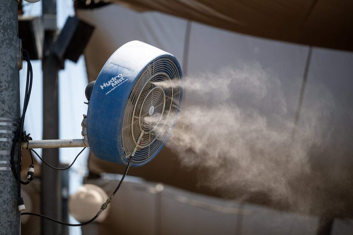 A cooling fan sprays a mist of water during the California State Fair media day at Cal Expo in Sacramento on Wednesday, July 15, 2026.