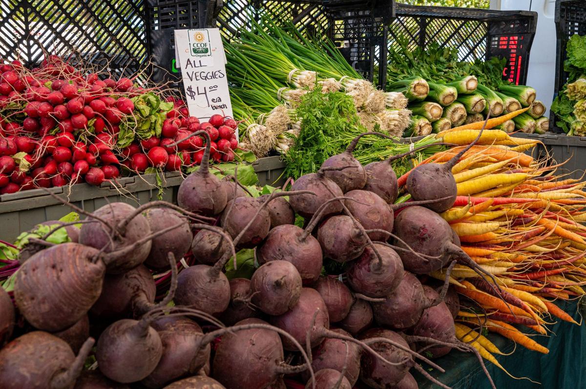Radishes, green onions, beetroots and carrots from California Certified Organic Farmers are available at the Meadoview Farmers’ Market in Sacramento on June 23.